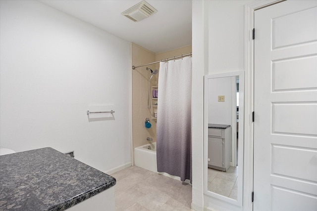 bathroom featuring tile patterned floors and shower / tub combo