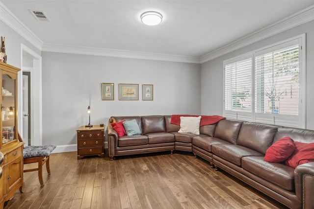 living room featuring hardwood / wood-style floors and ornamental molding