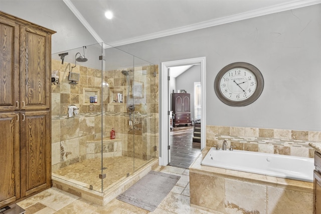 bathroom with lofted ceiling, independent shower and bath, and ornamental molding