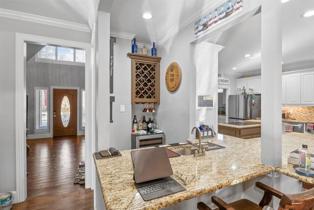 living room with ceiling fan, a fireplace, high vaulted ceiling, and hardwood / wood-style flooring