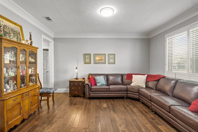 dining room with dark hardwood / wood-style flooring, a towering ceiling, ornamental molding, and a notable chandelier