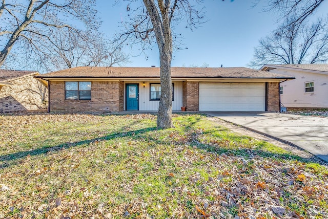 ranch-style home with a garage and a front yard