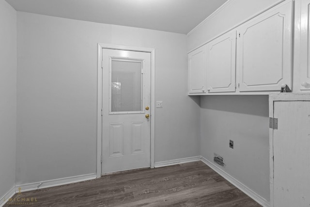 washroom featuring cabinets, electric dryer hookup, and dark hardwood / wood-style flooring