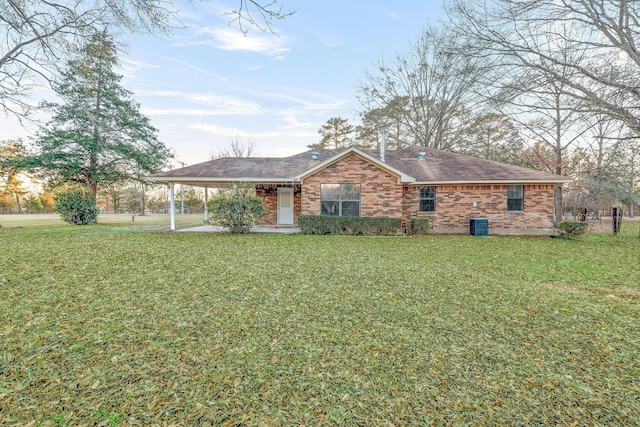 ranch-style home featuring a front yard