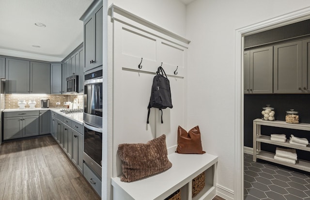 mudroom featuring dark wood-type flooring