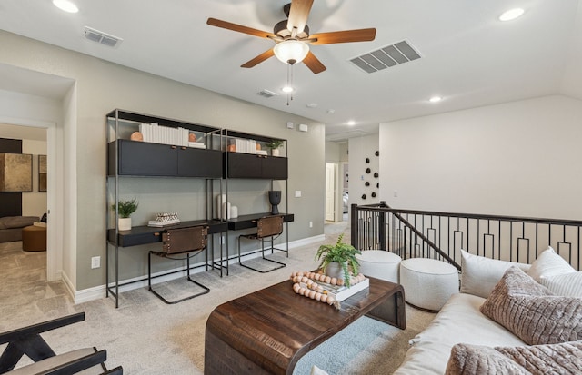 living room with light colored carpet and ceiling fan