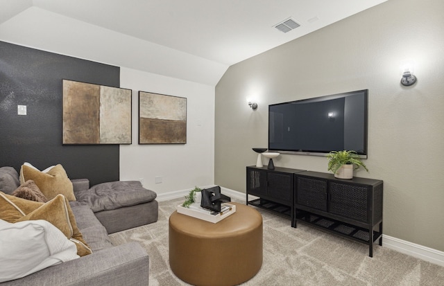 living room featuring lofted ceiling and light colored carpet