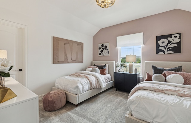 bedroom featuring lofted ceiling and carpet flooring