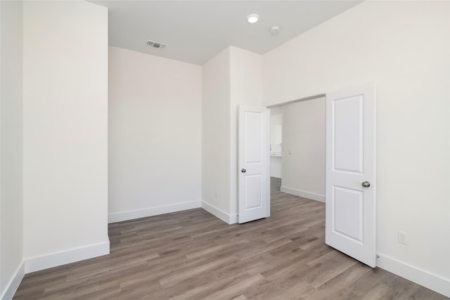 empty room featuring wood-type flooring