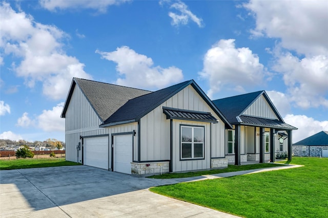 view of side of home featuring a garage, a yard, and covered porch