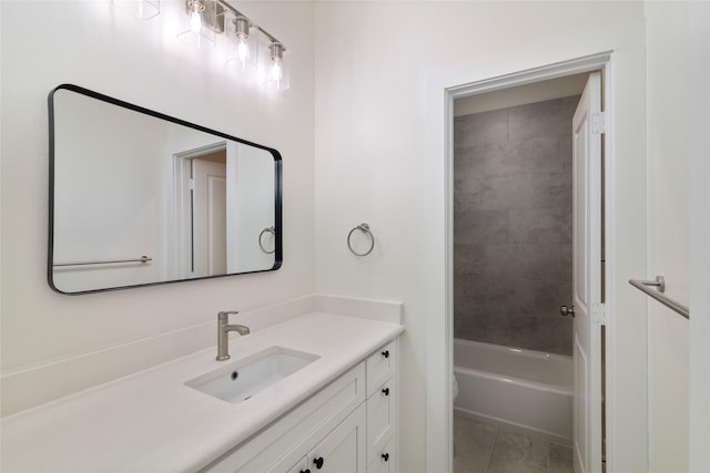 full bathroom with tile patterned floors, vanity, toilet, and tiled shower / bath combo