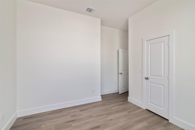 unfurnished room featuring light wood-type flooring