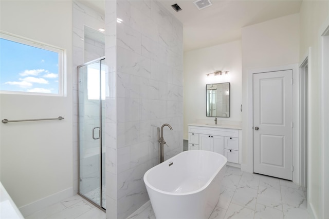 bathroom featuring shower with separate bathtub and vanity