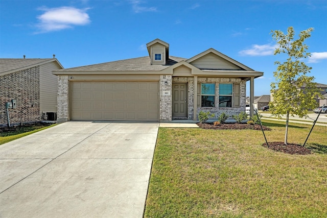 view of front of home featuring a garage and a front lawn