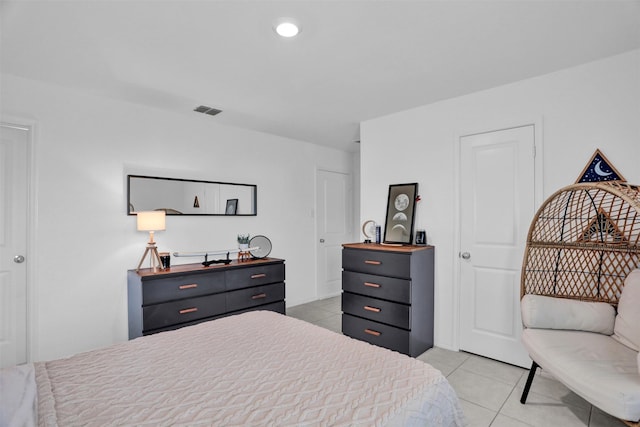 bedroom featuring light tile patterned floors