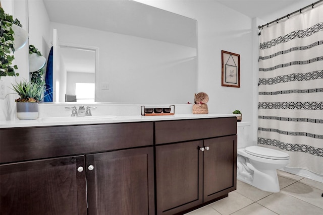 bathroom with a shower with curtain, tile patterned flooring, vanity, and toilet