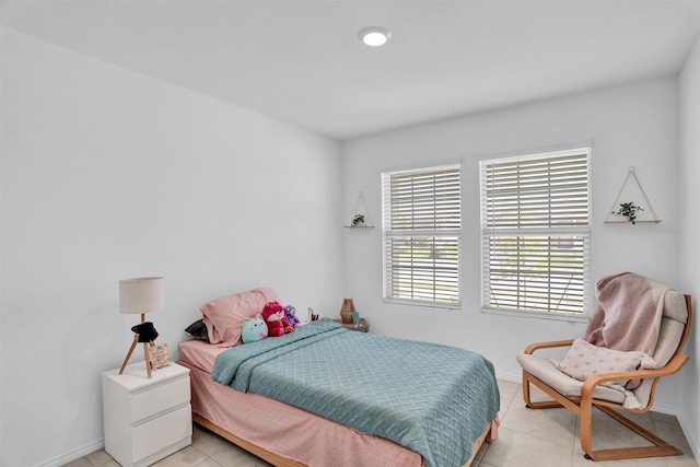 bedroom with light tile patterned floors