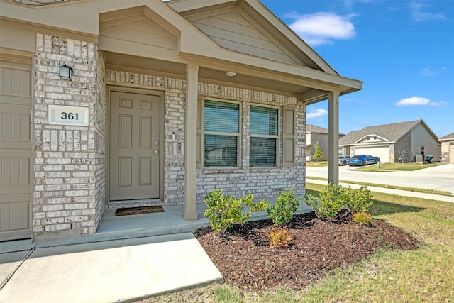 property entrance with covered porch