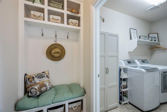 laundry area featuring washing machine and clothes dryer