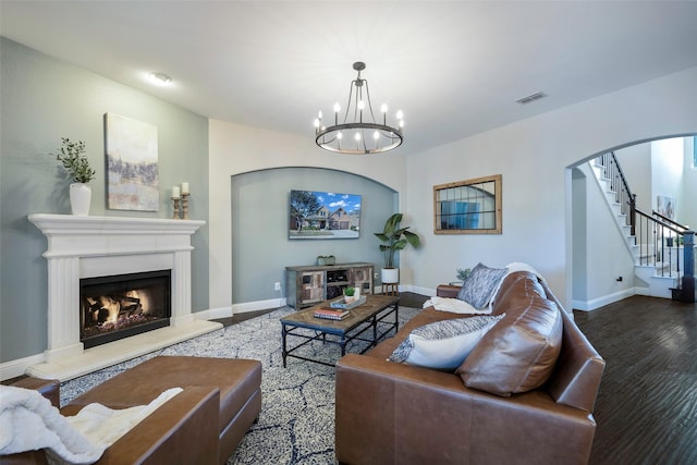 living room with a chandelier and hardwood / wood-style flooring