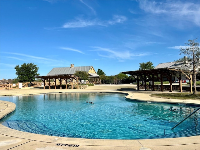 view of pool featuring a gazebo and a patio