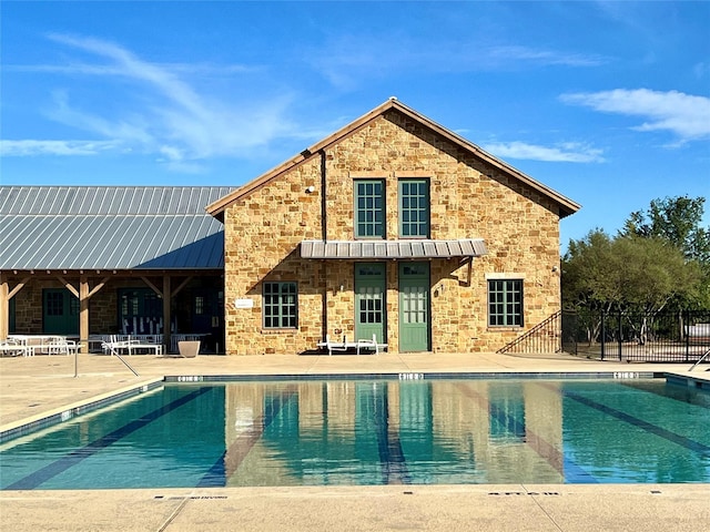 exterior space featuring a patio area and a community pool