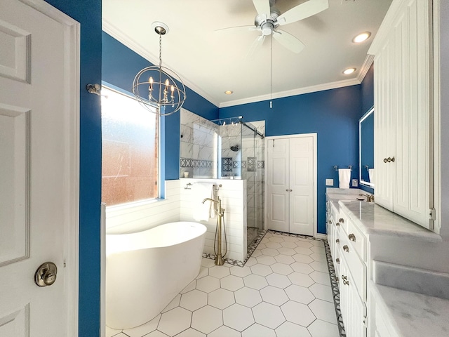 bathroom with ornamental molding, separate shower and tub, ceiling fan with notable chandelier, and vanity