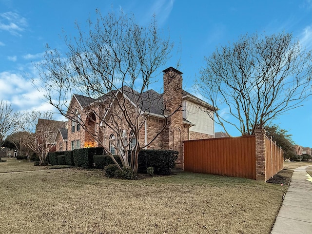 view of side of home featuring a yard