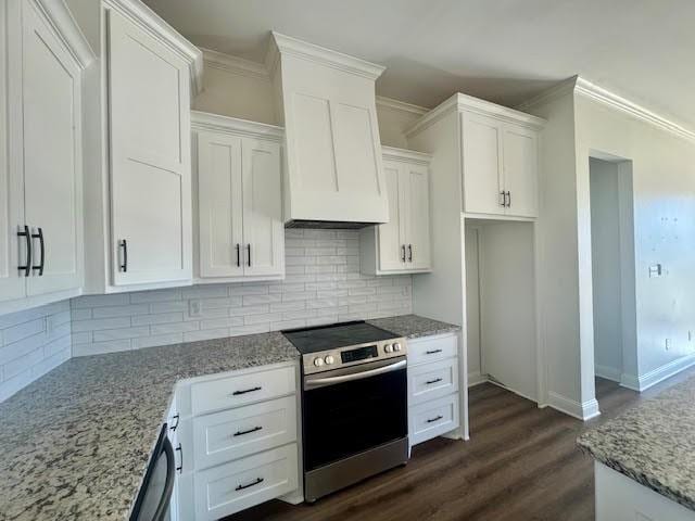 kitchen with appliances with stainless steel finishes, backsplash, ornamental molding, dark hardwood / wood-style floors, and white cabinetry