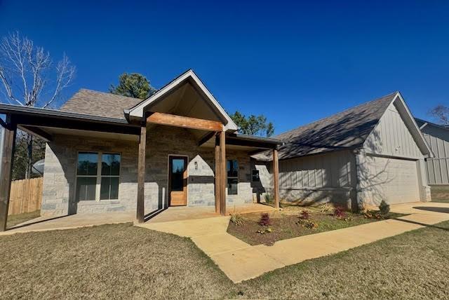 view of front facade with a front lawn and a garage