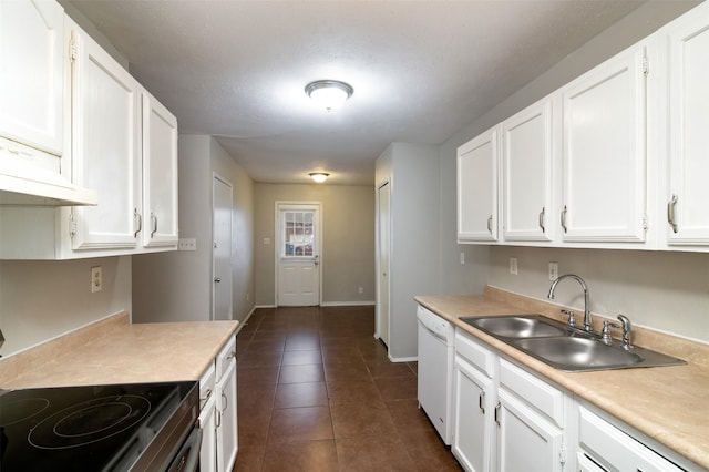 kitchen featuring white cabinets, white dishwasher, sink, range with electric stovetop, and dark tile patterned floors