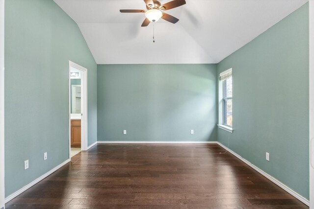 empty room featuring ceiling fan, dark hardwood / wood-style floors, and vaulted ceiling