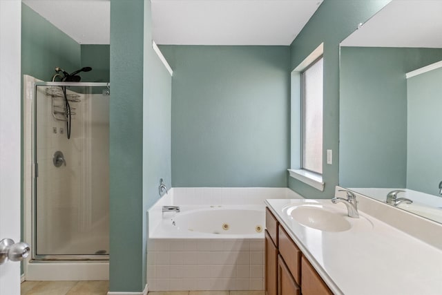 bathroom with tile patterned flooring, vanity, and shower with separate bathtub