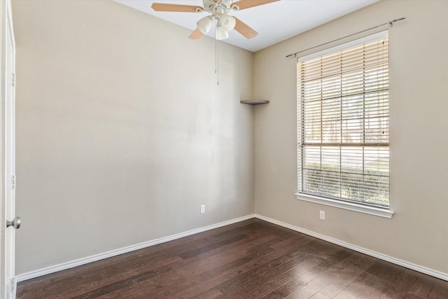 unfurnished room featuring ceiling fan and dark wood-type flooring