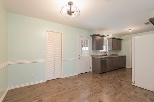 309 Rock Ct, Princeton, TX 75407 - kitchen with a sink, visible vents, dishwasher, dark wood-style flooring, and baseboards