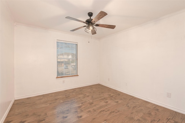 spare room with ornamental molding, dark hardwood / wood-style floors, and ceiling fan