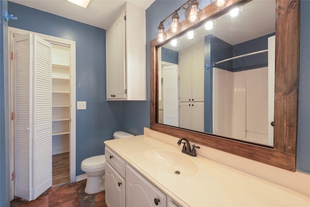 309 Rock Ct, Princeton, TX 75407 - bathroom featuring a closet, toilet, baseboards, and vanity