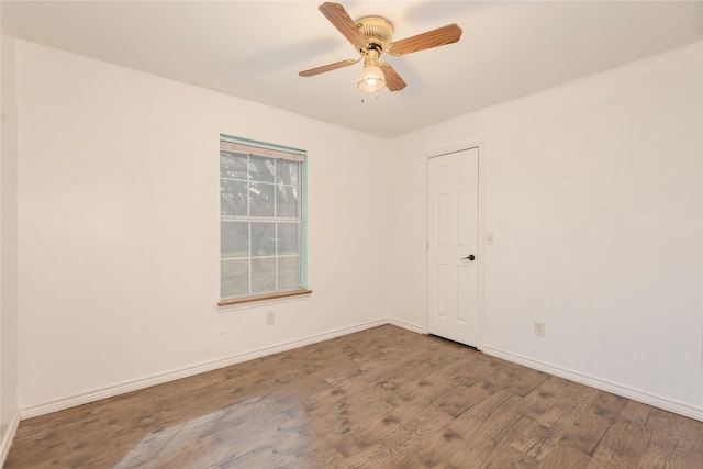 spare room featuring hardwood / wood-style flooring and ceiling fan