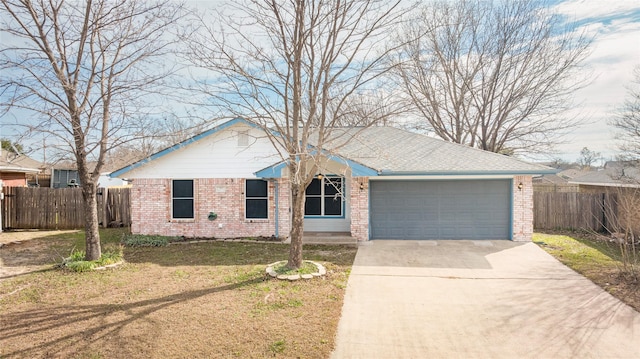 ranch-style house featuring a garage and a front yard