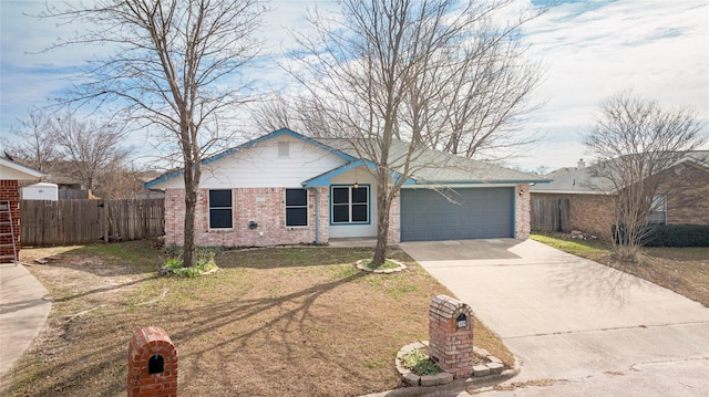 309 Rock Ct, Princeton, TX 75407 - ranch-style house featuring concrete driveway, brick siding, fence, and a garage