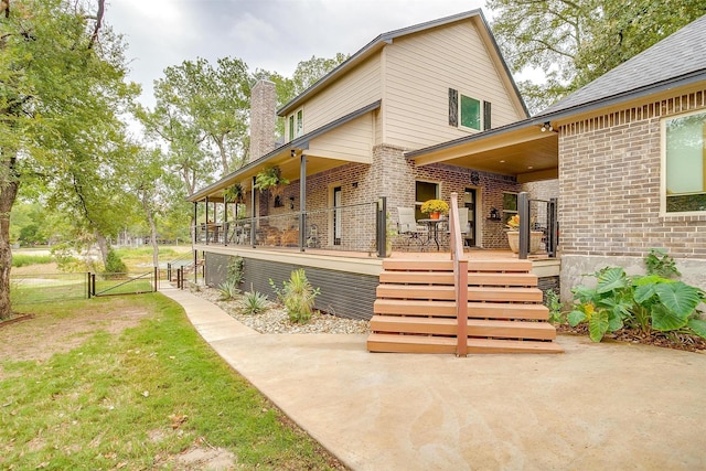 rear view of house with a patio