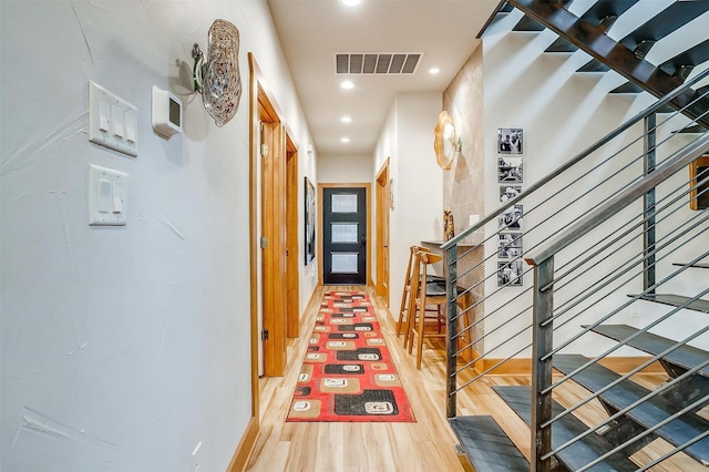 hallway featuring hardwood / wood-style flooring