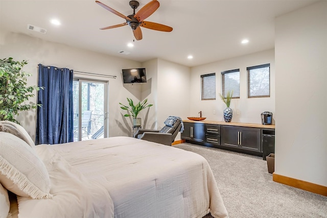 carpeted bedroom featuring access to exterior and ceiling fan