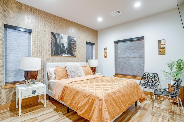 bedroom with hardwood / wood-style floors