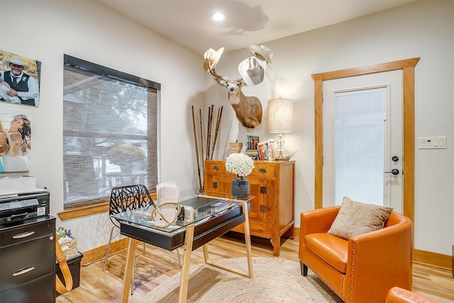 sitting room with light hardwood / wood-style flooring