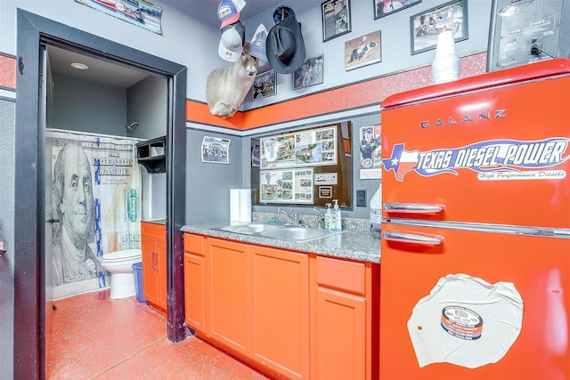 bar with sink and refrigerator