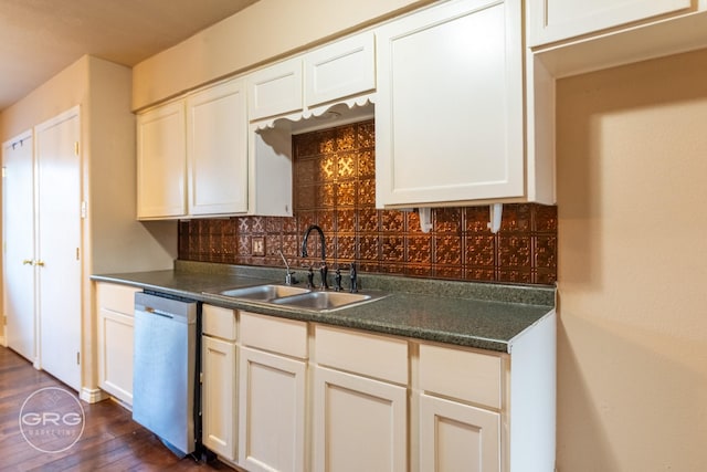 kitchen featuring tasteful backsplash, stainless steel dishwasher, dark wood-type flooring, sink, and white cabinetry