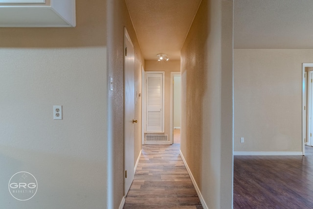 hallway featuring hardwood / wood-style flooring