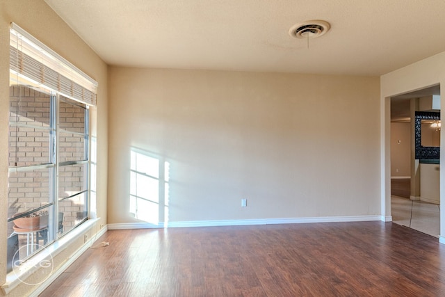 empty room featuring hardwood / wood-style floors