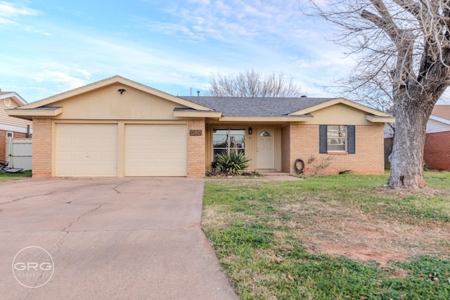 ranch-style home featuring a front lawn and a garage